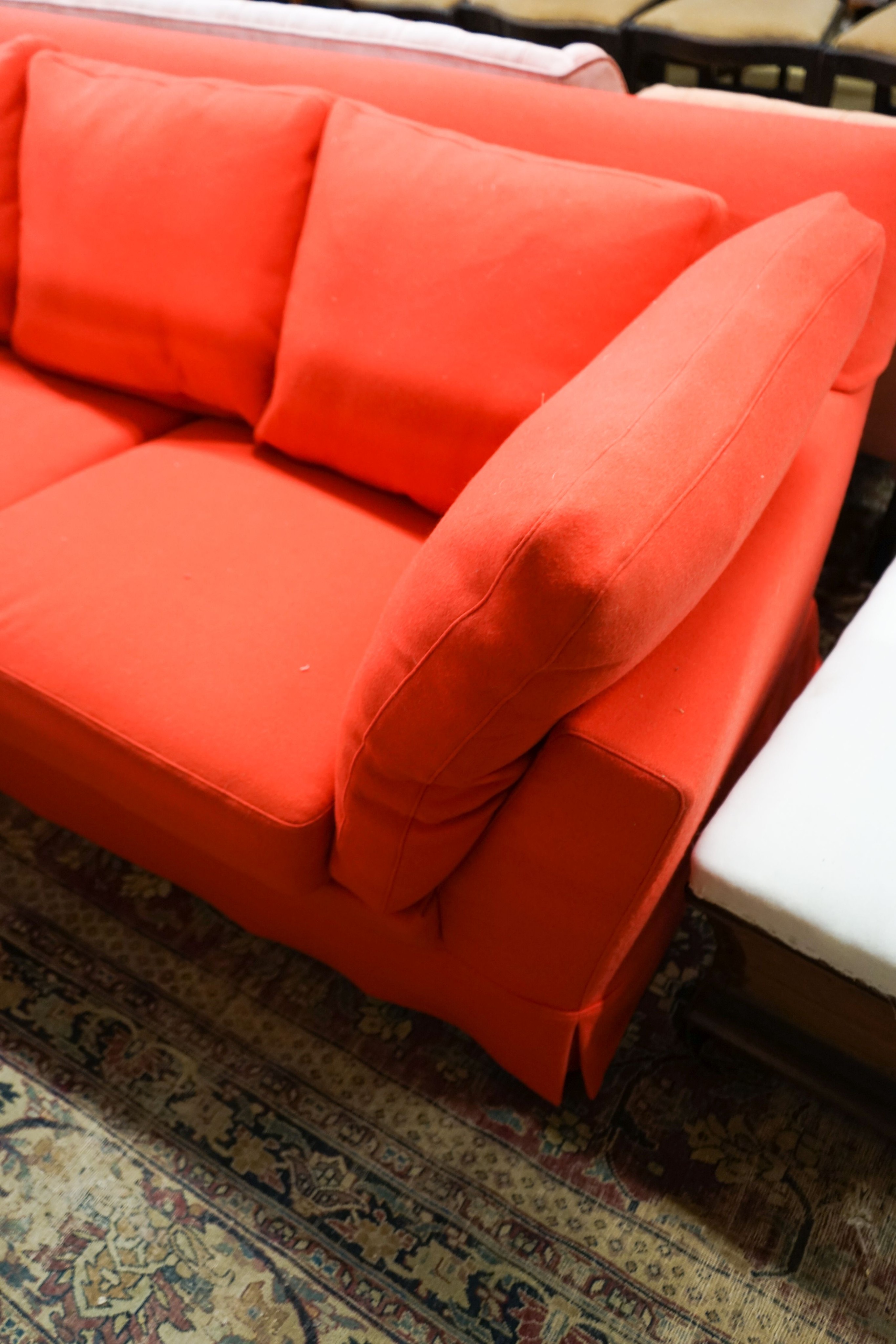 A contemporary Moroso three seater and two seater sofa upholstered in red fabric, the larger length 250cm, depth 100cm, height 79cm